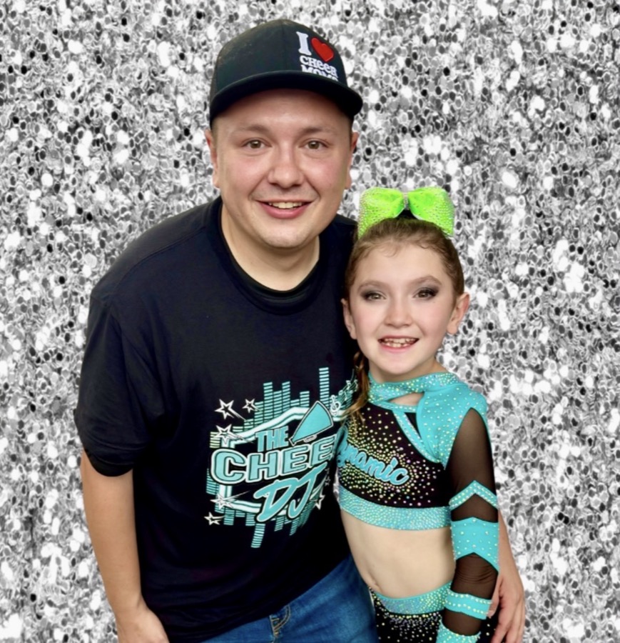 David, The Cheer DJ, with his daughter at a competition